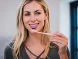 brush your teeth with activated charcoal powder
